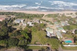 an aerial view of a house next to the beach at 7th Heaven in Tugela Mouth