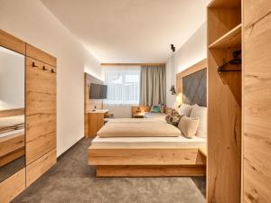 Posteľ alebo postele v izbe v ubytovaní Sun Lodge