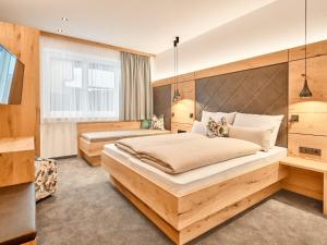 Posteľ alebo postele v izbe v ubytovaní Sun Lodge