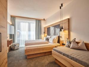 Posteľ alebo postele v izbe v ubytovaní Sun Lodge