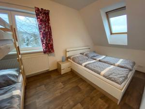 Postel nebo postele na pokoji v ubytování Apartmány Klárka