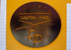 a sign for a restaurant with a pasta food at Radics Panzió Étterem és Pihenő Központ in Letenye