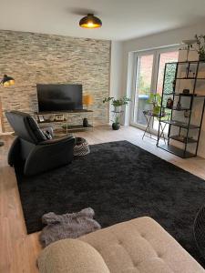 TV a/nebo společenská místnost v ubytování Lux Apartmant 2 Westerstede + 20 fotografií