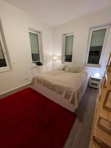 מיטה או מיטות בחדר ב-Lux Apartmant 2 Westerstede