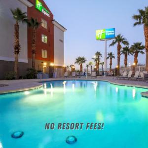 a swimming pool with a sign that says no resort fees at Holiday Inn Express Las Vegas Stadium Area, an IHG Hotel in Las Vegas