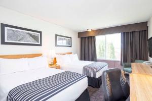 Voodi või voodid majutusasutuse Sandman Inn McBride toas