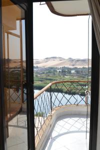 a view from the balcony of a house at ASWAN NILE PALACE (swimming pool-rooftop-Nile view) in Aswan