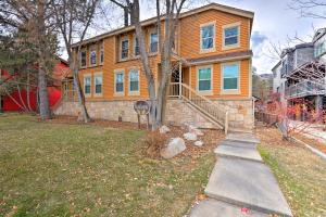 a large orange house with a staircase in a yard at Park City Condo, Walk to Park City Mtn Lifts! in Park City