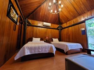 Giường trong phòng chung tại CASA ECO Mekong Homestay