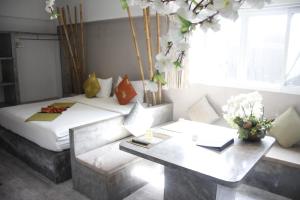 Postel nebo postele na pokoji v ubytování Samui Beach Residence Hotel