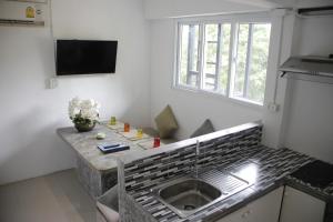 TV a/nebo společenská místnost v ubytování Samui Beach Residence Hotel