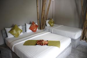 Postel nebo postele na pokoji v ubytování Samui Beach Residence Hotel