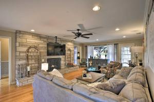 a living room with a couch and a fireplace at Charming Florence Getaway with Fireplace and Grill! in Florence