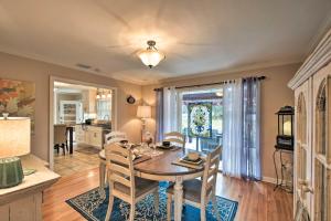 a kitchen and dining room with a table and chairs at Charming Florence Getaway with Fireplace and Grill! in Florence