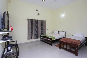 TV a/nebo společenská místnost v ubytování Coorg North Breeze Homestay