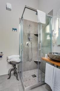 a bathroom with a shower and a sink at Casa Gardenia -affittacamere in Gatteo +36 photos