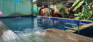 a pool of water with a bench in the middle at Baan Asree homestayบ้านอัสรี in Ao Nang Beach