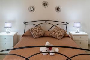 Ένα ή περισσότερα κρεβάτια σε δωμάτιο στο Il Borgo Appartamenti