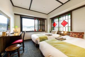 Postel nebo postele na pokoji v ubytování Hotel Aru Kyoto Sanjo Kiyamachi Do-ri