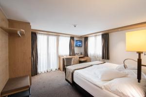 A bed or beds in a room at Hotel AMBiANCE