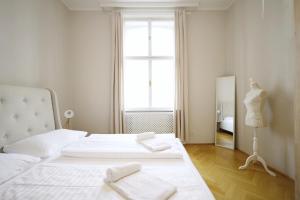 Postel nebo postele na pokoji v ubytování HeyMi Apartments Karlsplatz