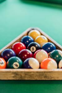 a group of billiard balls in a pool table at Dormy House in Étretat