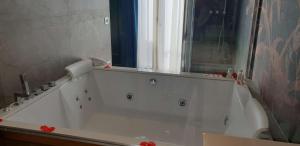 a white bath tub in a bathroom with a window at Best Western Plus Hotel Perla Del Porto in Catanzaro Lido