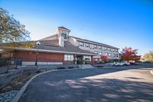 a large building with a cross on the side of it at Quality Hotel Burlington in Burlington