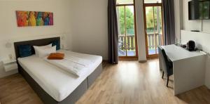 
Ein Bett oder Betten in einem Zimmer der Unterkunft Parkhotel Cham
