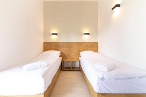 Postel nebo postele na pokoji v ubytování Hotel Konopielka