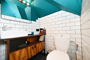 a bathroom with a toilet and a sink at Pokoje na Jasnej in Szczyrk +23 photos