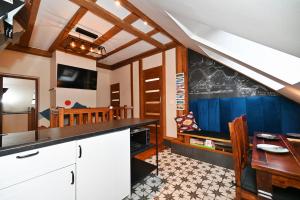 a kitchen with a table and a chalkboard on the wall at Pokoje na Jasnej in Szczyrk