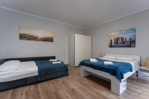 Posteľ alebo postele v izbe v ubytovaní Sopot Host Garden