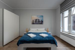 Posteľ alebo postele v izbe v ubytovaní Sopot Host Garden