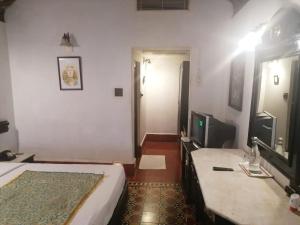 Postel nebo postele na pokoji v ubytování Indeco Hotels Swamimalai