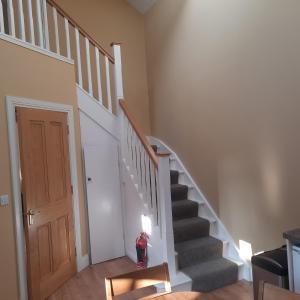 a staircase in a home with a stair case at Holywood House No 2 in Hollywood