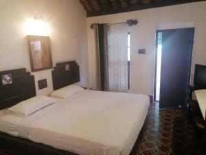 Postel nebo postele na pokoji v ubytování Indeco Hotels Swamimalai