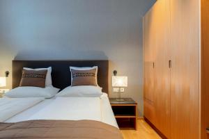 Posteľ alebo postele v izbe v ubytovaní Schneeglöckle Appartements