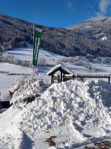 a pile of snow in front of a building at Hansalagut in Mauterndorf