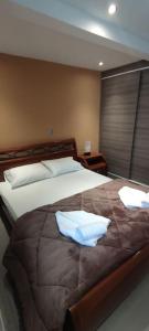 Un pat sau paturi într-o cameră la Astra House