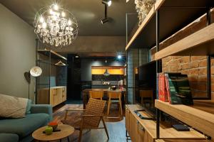 a living room with a couch and a table at Premium Luxury SeaSide Apartment in Burgas City