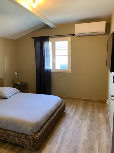 En eller flere senge i et værelse på Appartement, centre ville AIGUILLON