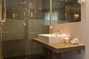 a bathroom with a sink and a shower at Hotel Belvedere in Milano Marittima