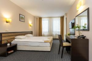 A bed or beds in a room at Hotel Mursalitsa by HMG - Half board