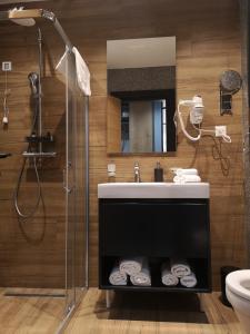 a bathroom with a sink and a shower at MM Kolasin Lux N1 in Kolašin +24 photos