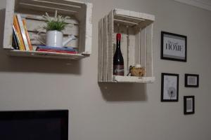 a bottle of wine in a shelf on a wall at Casa Planta Baja.VTLR1431 in Rincón de Soto