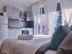 Kuchyň nebo kuchyňský kout v ubytování Michelangelo Apartments con parcheggio gratuito in loco e self check in