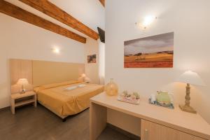 A bed or beds in a room at Affittacamere Da Flo