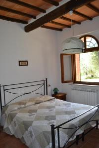 Ένα ή περισσότερα κρεβάτια σε δωμάτιο στο Villa Santa Maria