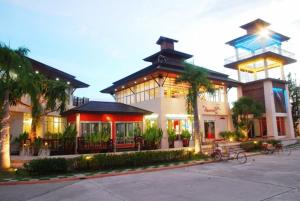 a large building with a tower on top of it at The Adventure Hotel in Chiang Mai